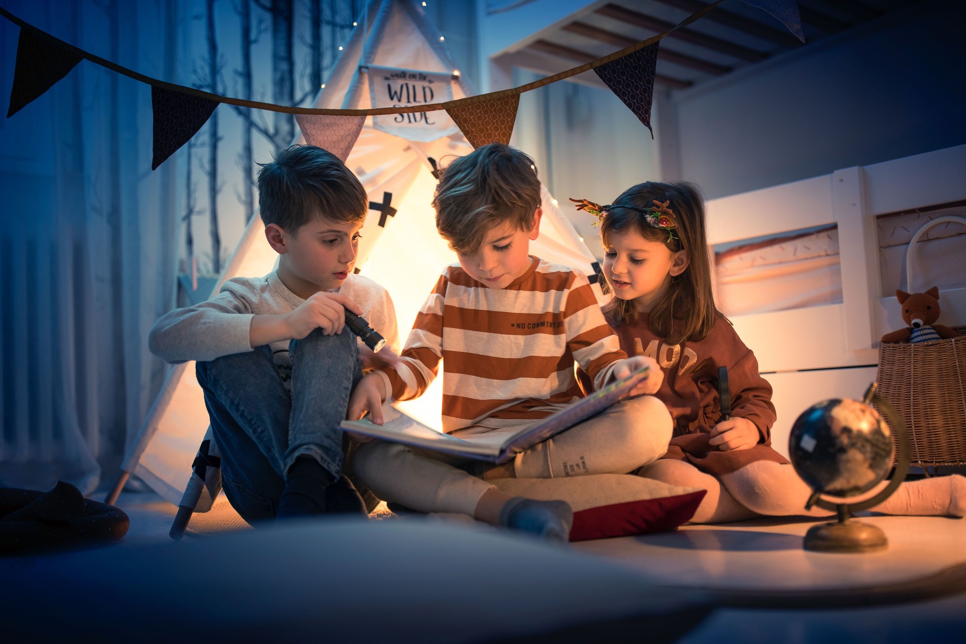 Cute kids play camping in kids room