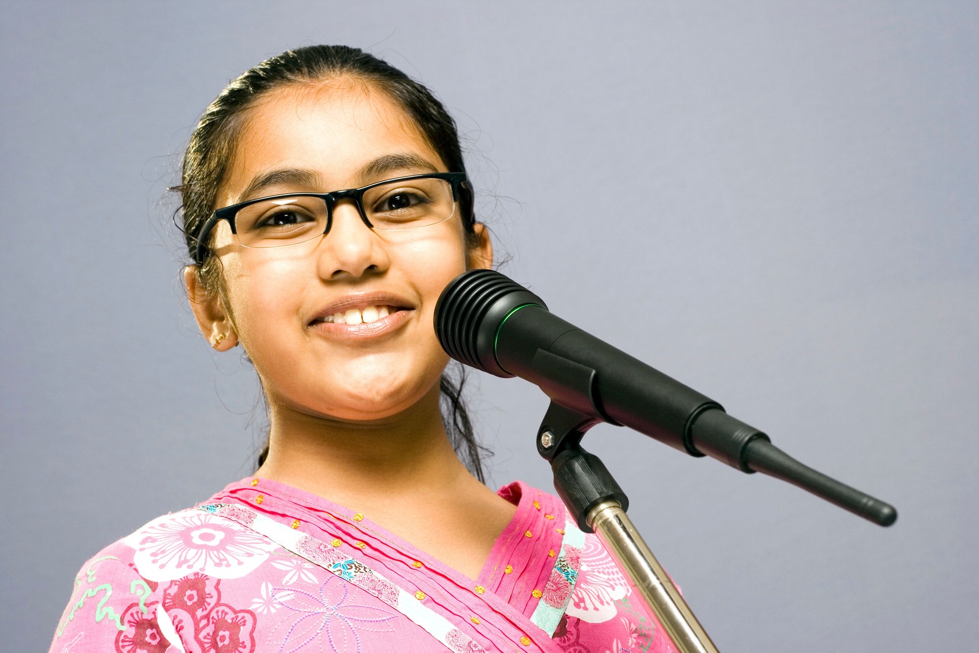 One Cute Little Indian girl with Microphone